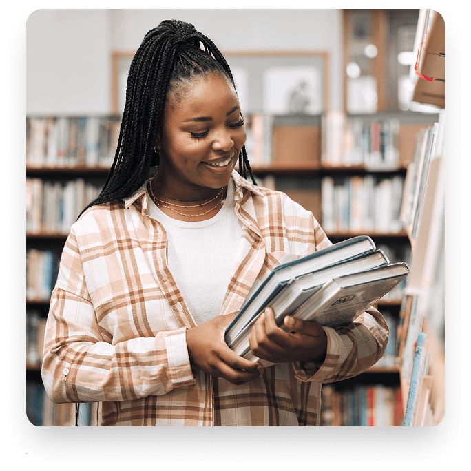 Student holding educational materials in the archives